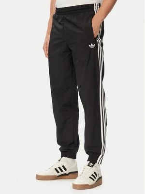 Obrázek produktu adidas Teplákové kalhoty Firebird Woven KE1371 Černá Regular Fit