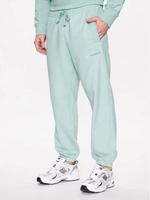 Obrázek produktu New Balance Teplákové kalhoty MP23551 Zelená Relaxed Fit