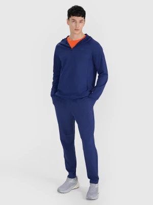 Obrázek produktu Pánské sportovní rychleschnoucí kalhoty 4F x Robert Lewandowski - tmavě modré