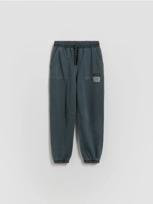 Obrázek produktu Reserved - Joggery se sepraným efektem - tmavomodrá