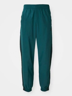 Obrázek produktu Teplákové kalhoty adidas Originals zelená evergreen
