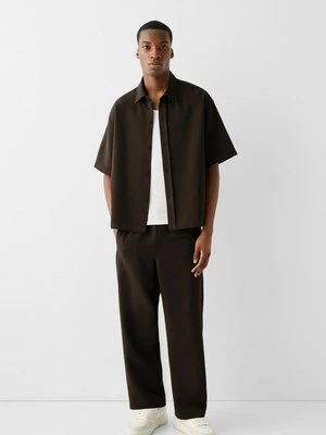 Obrázek produktu Teplákové kalhoty Bershka tmavě hnědá