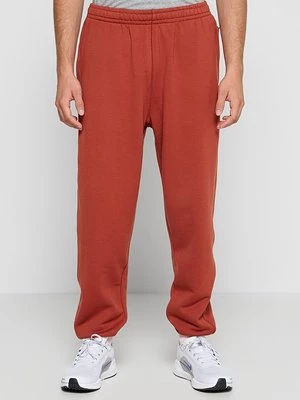 Obrázek produktu Teplákové kalhoty Nike kamenná