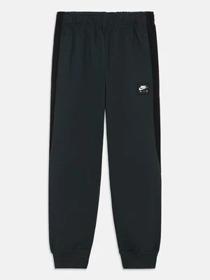 Obrázek produktu Teplákové kalhoty Nike tmavě zelená