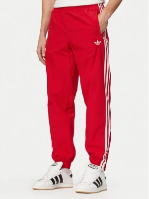 Obrázek produktu adidas Teplákové kalhoty Firebird Woven KE1369 Červená Regular Fit