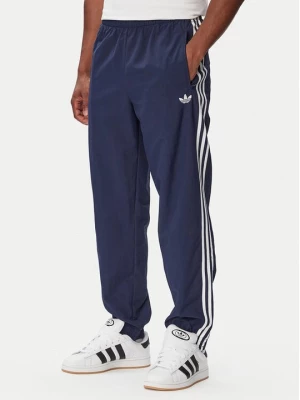 Obrázek produktu adidas Teplákové kalhoty Firebird Woven KE1370 Tmavomodrá Regular Fit