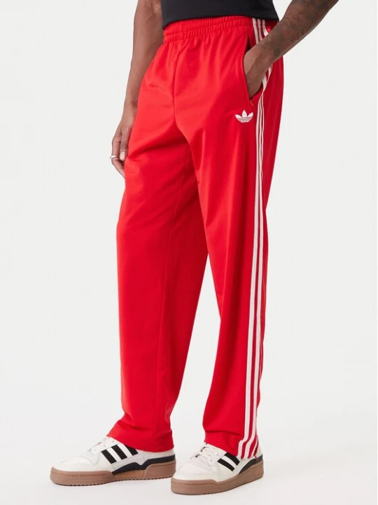 Obrázek produktu adidas Teplákové kalhoty Firebird KD8319 Červená Loose Fit