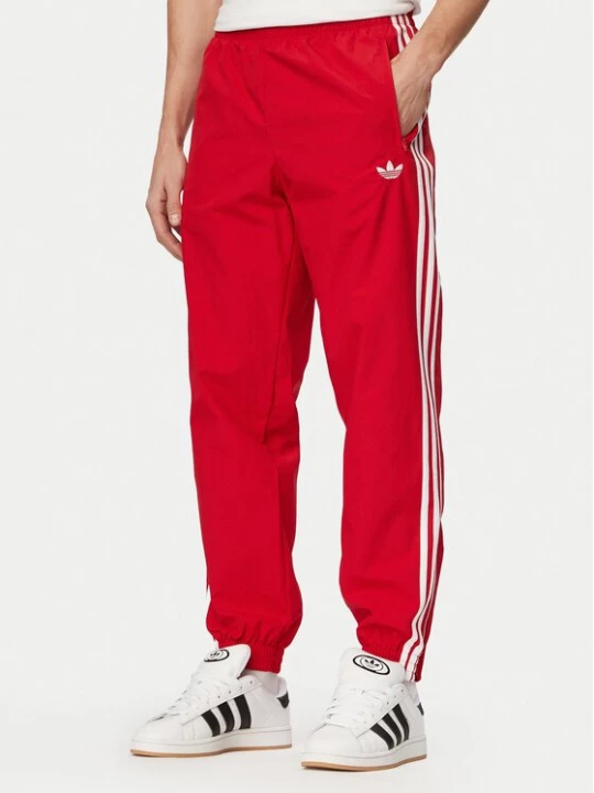 Obrázek produktu adidas Teplákové kalhoty Firebird Woven KE1369 Červená Regular Fit