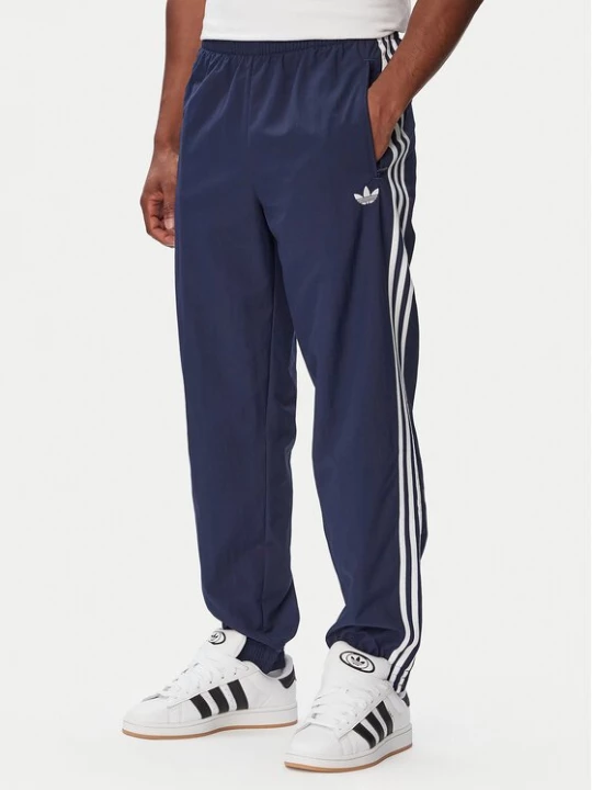 Obrázek produktu adidas Teplákové kalhoty Firebird Woven KE1370 Tmavomodrá Regular Fit