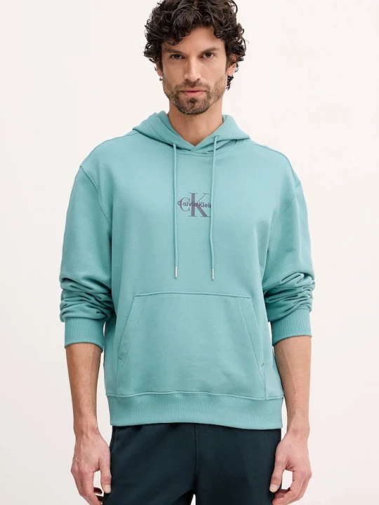 Obrázek produktu Calvin Klein Jeans mikina kapucí pánská bavlněná tyrkysová
