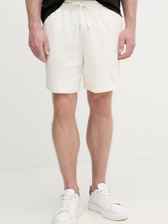 Obrázek produktu Calvin Klein Jeans teplákové šortky pánské bavlněné béžová