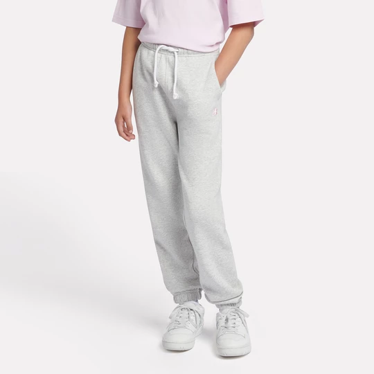 Obrázek produktu Dětské kalhoty New Balance LAKG0058AHH – šedé