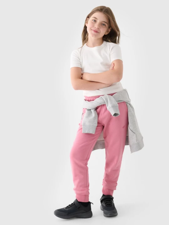 Obrázek produktu Dívčí tepláky typu jogger - růžové 4F