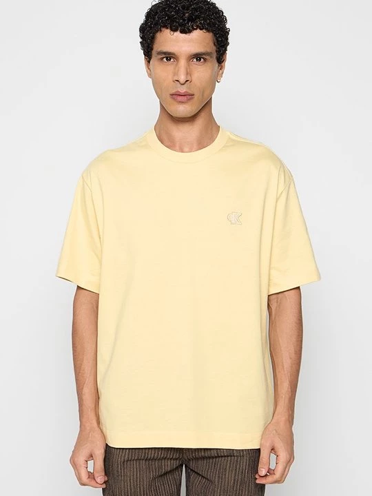 Obrázek produktu Jednoduché tričko Calvin Klein Jeans skvrnitě světle žlutá