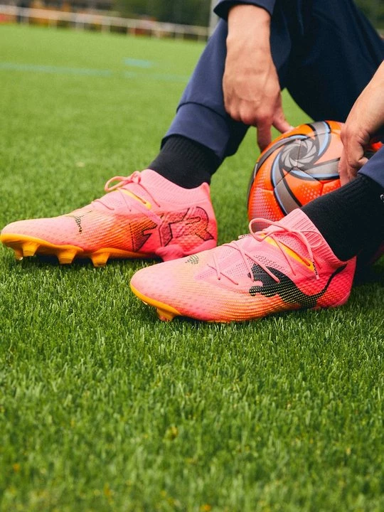 Obrázek produktu Kopačky pro pevný povrch Puma skvrnitě oranžová