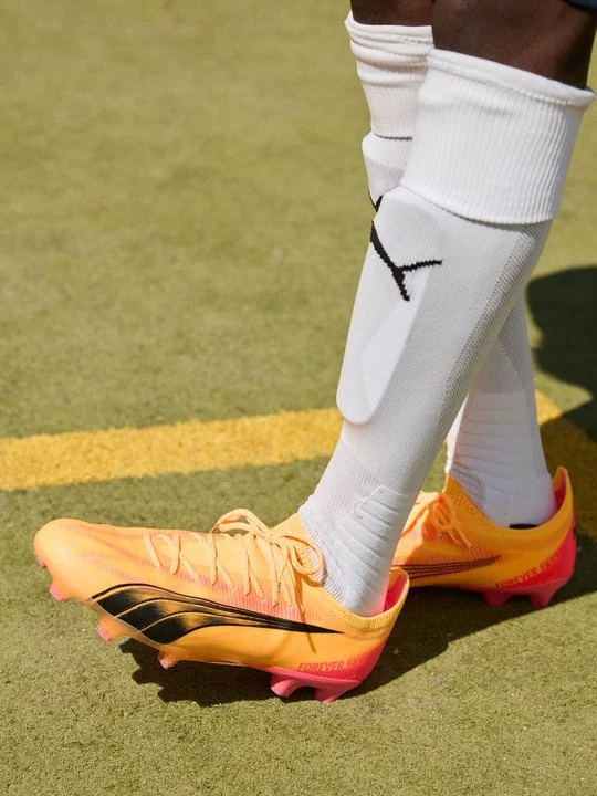 Obrázek produktu Kopačky pro pevný povrch Puma skvrnitě žlutá