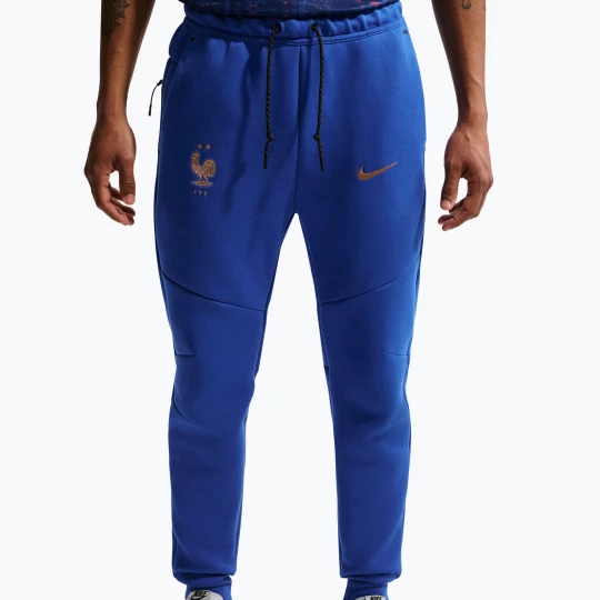 Obrázek produktu Pánské fotbalové kalhoty Nike FFF Tech Fleece Joggers game royal / metallic copper Modrá