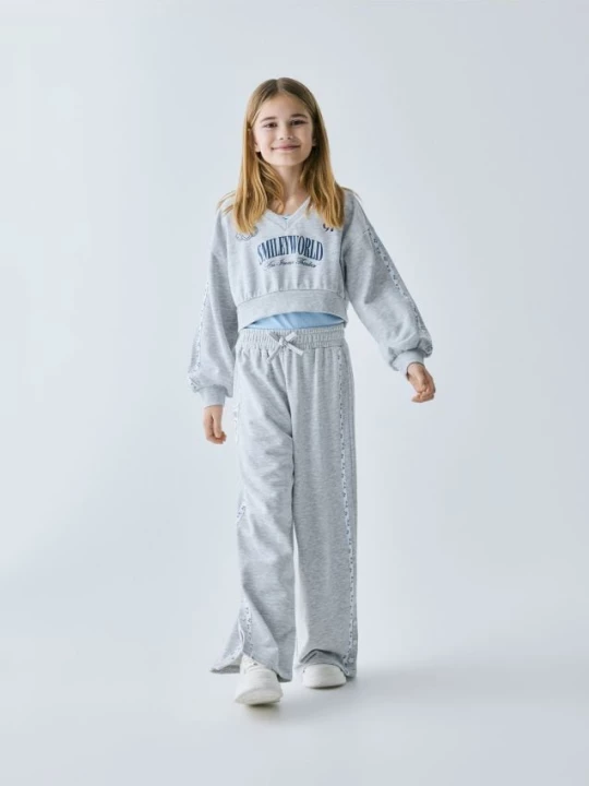 Obrázek produktu Reserved - Teplákové kalhoty SmileyWorld® - světle šedá