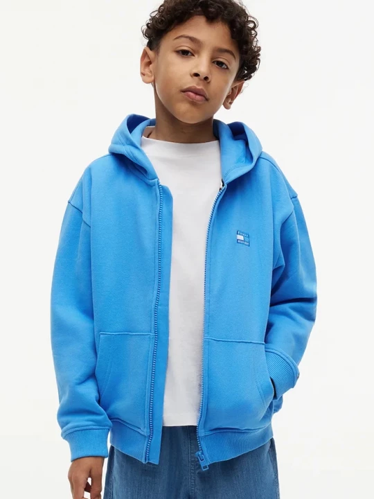 Obrázek produktu Tommy Hilfiger rozepínací mikina s kapucí dětská bavlněná modrá