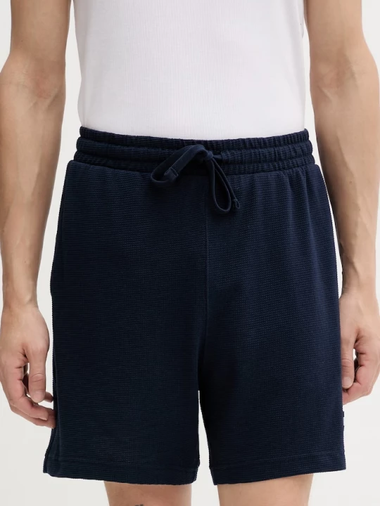 Obrázek produktu Tommy Jeans teplákové šortky pánské s bavlnou námořnická modř