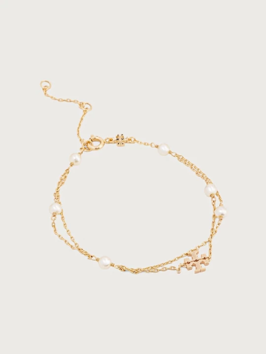Obrázek produktu Tory Burch náramek dámský pozlacený kov Moondance zlatá