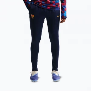 Obrázek produktu Pánské fotbalové kalhoty Nike FC Barcelona Strike Dri-Fit blackened blue / noble red / yellow Námořnická modř