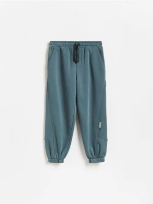 Obrázek produktu Reserved - Baggy joggery s bavlnou - tmavě tyrkysová