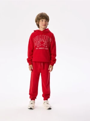 Obrázek produktu Reserved - Bavlněné kalhoty joggers - červená