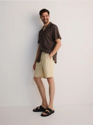 Obrázek produktu Reserved - Jednobarevné šortky loose fit - béžová