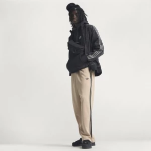 Obrázek produktu SPORTOVNÍ KALHOTY ADICOLOR LOOSE Adidas