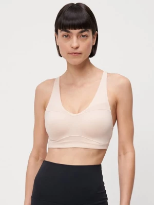 Obrázek produktu Sportovní podprsenky se střední oporou Under Armour béžová
