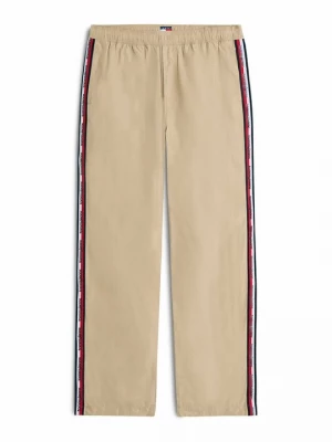 Obrázek produktu Teplákové kalhoty Tommy Jeans zlatá barva