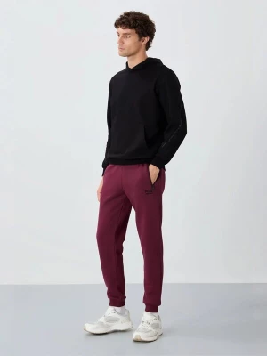 Obrázek produktu Tommy Life Sportovní kalhoty 'Jogginghose' burgundská červeň